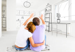 Couple deciding the locations of the furniture