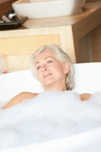 elderly woman in a tub