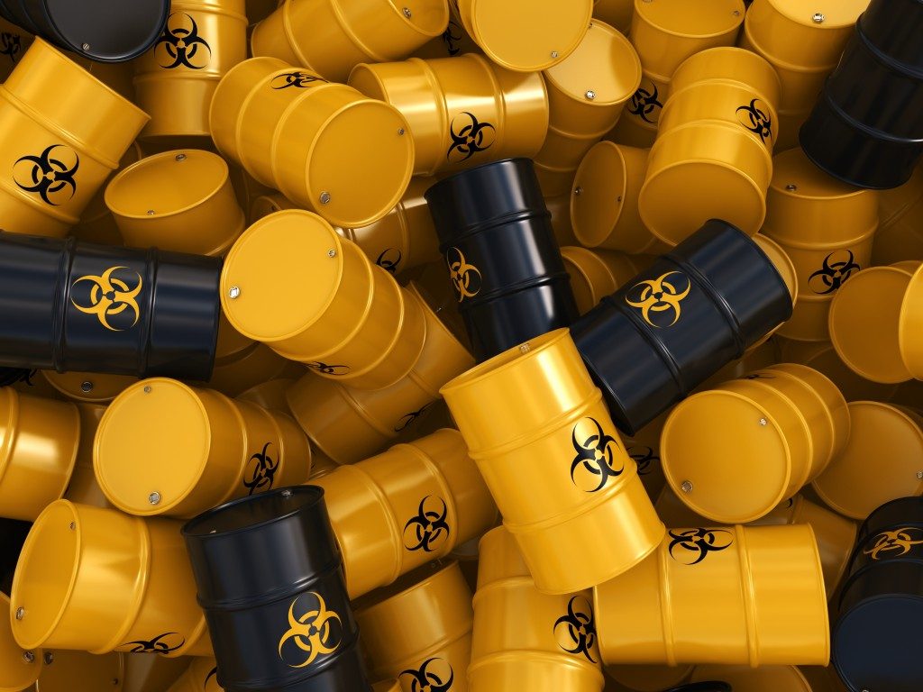 Yellow and black hazardous barrels