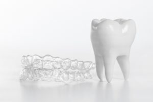 clear braces and a tooth model