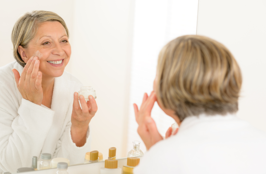 Woman applying facial cream