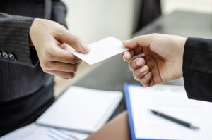 two people exchanging business card