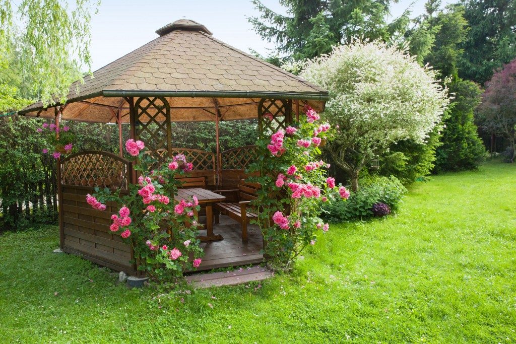 Outdoor wooden gazebo with roses