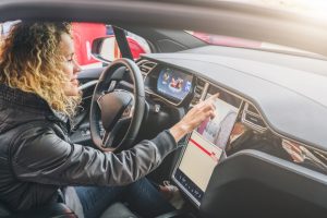 Woman controlling her navigation system