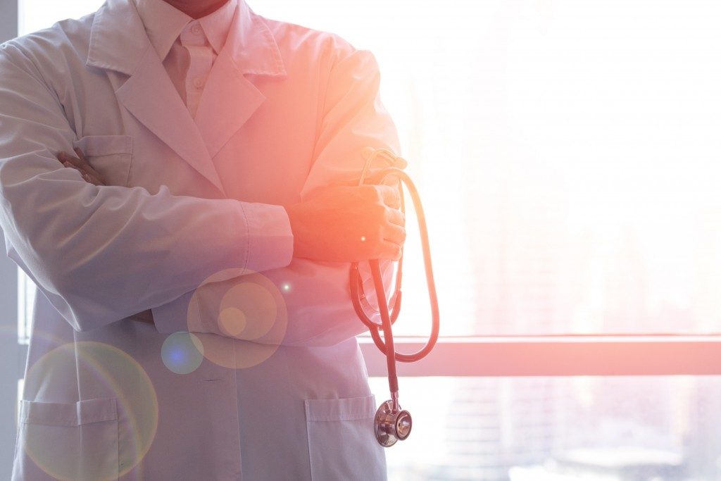 Neurologist beside the window