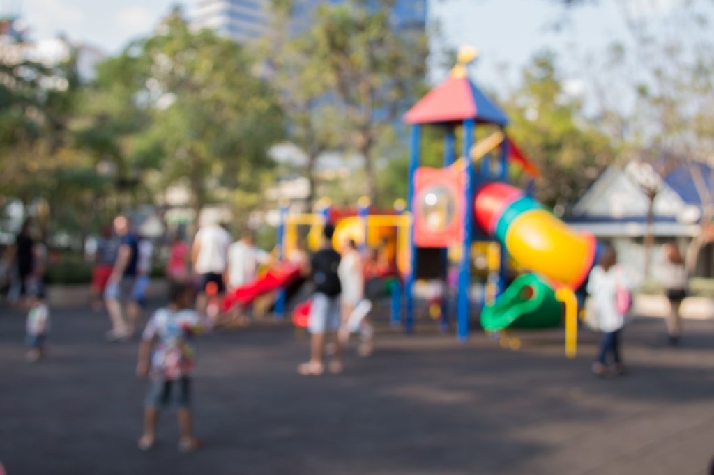 Defocused and blurred image for background of children's playground,activities at public park