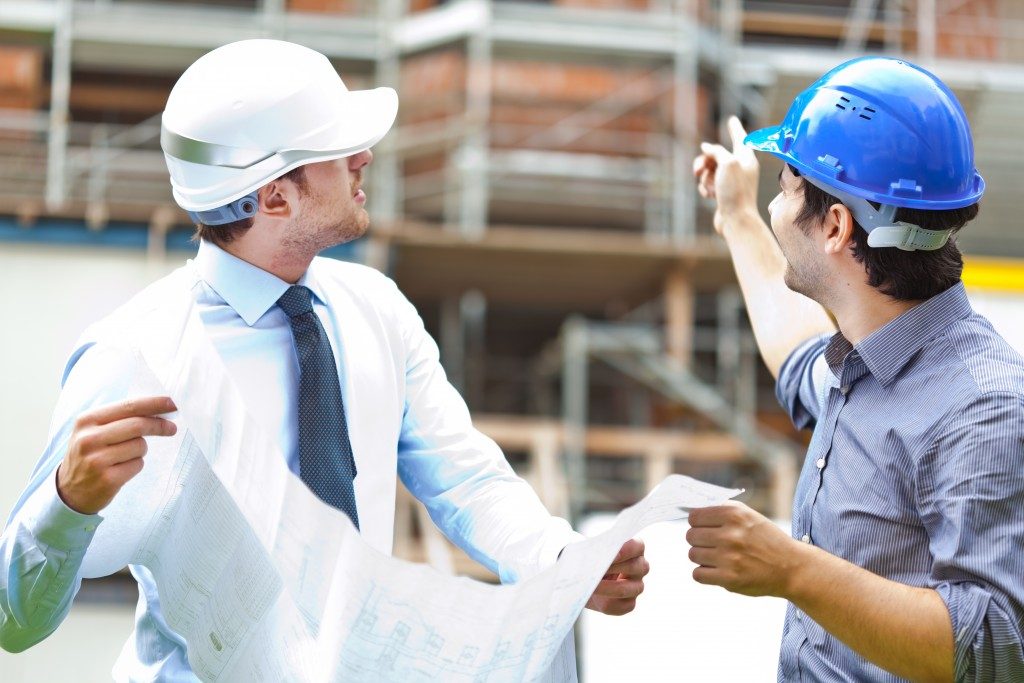 Two engineers working in a construction site