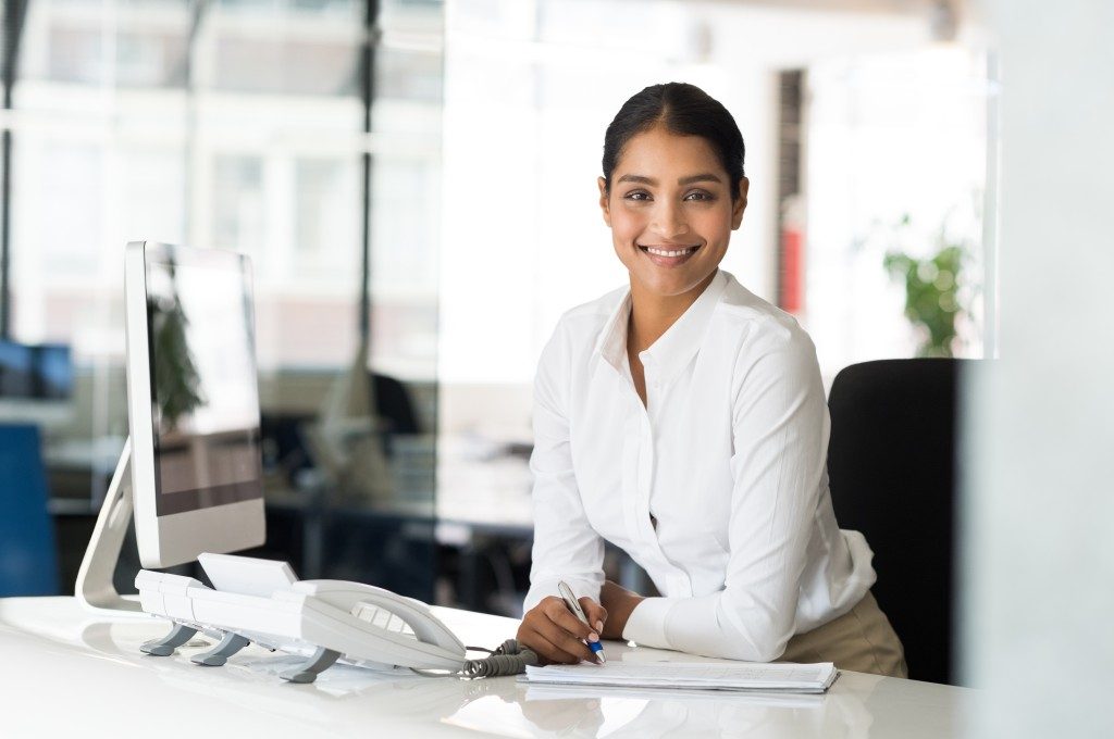 office receptionist taking down notes