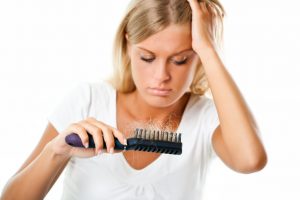 woman suffering from hair loss